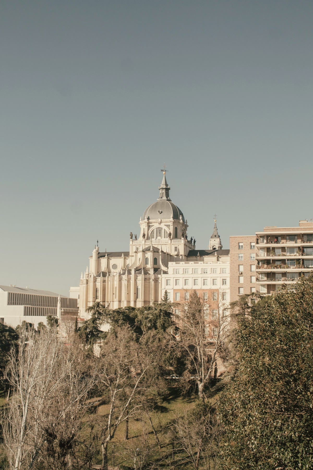 Almudena Cathedral above the autumn trees of Madrid